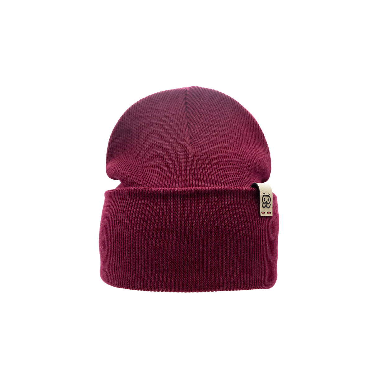A maroon Goggleface Organic Beanie features a ribbed texture and a folded brim, adorned with a small beige tag on the lower right side that showcases a minimalist face logo. This timeless accessory in sustainable fashion stands out against the white background, accentuating its snug and cozy appearance.
